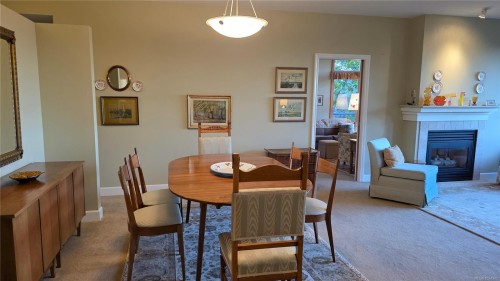 108-5329 Cordova Bay Rd, Saanich, BC - Indoor Photo Showing Dining Room With Fireplace
