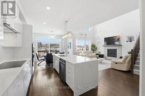 605 Enclave Lane, Clarence-Rockland, ON - Indoor Photo Showing Kitchen With Fireplace With Upgraded Kitchen