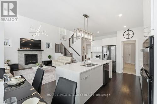 605 Enclave Lane, Clarence-Rockland, ON - Indoor Photo Showing Kitchen With Fireplace With Double Sink