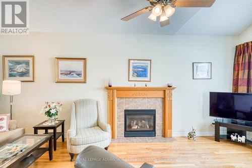 Warming natural gas fireplace ... - 10 Antonio Way, Perth, ON - Indoor Photo Showing Living Room With Fireplace