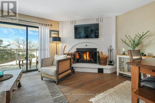 Living Room - 2E - 20 Ryder Drive, Mcdougall, ON - Indoor Photo Showing Living Room With Fireplace