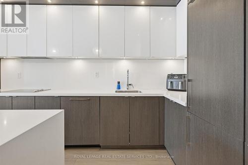 Granite Countertops and Integrated Appliances - 111 - 1284 Guelph Line, Burlington, ON - Indoor Photo Showing Kitchen