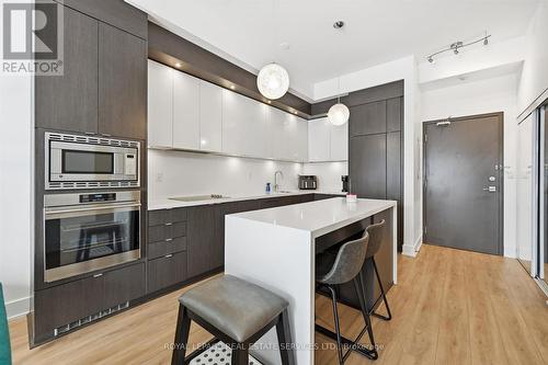 Granite Countertops and Integrated Appliances - 111 - 1284 Guelph Line, Burlington, ON - Indoor Photo Showing Kitchen With Upgraded Kitchen