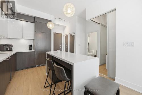 Kitchen Features an Island with Seating for Four - 111 - 1284 Guelph Line, Burlington, ON - Indoor Photo Showing Kitchen