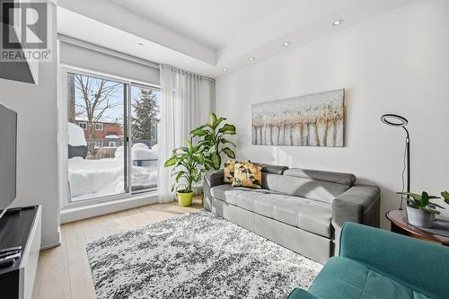 Living Area Opens to Impressive 21' x 12' Terrace - 111 - 1284 Guelph Line, Burlington, ON - Indoor Photo Showing Living Room
