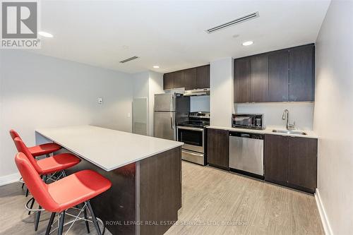 Party Room with a Fireplace and Full Kitchen - 111 - 1284 Guelph Line, Burlington, ON - Indoor Photo Showing Kitchen