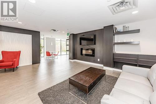 Party Room with a Fireplace and Full Kitchen - 111 - 1284 Guelph Line, Burlington, ON - Indoor Photo Showing Living Room With Fireplace