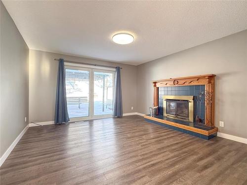 10 Jerome Drive, Brandon, MB - Indoor Photo Showing Living Room With Fireplace