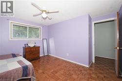 Bedroom featuring parquet floors and ceiling fan - 