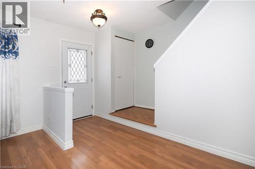 Foyer with baseboards and wood finished floors - 10 Balfour Crescent, Kitchener, ON - Indoor Photo Showing Other Room