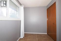 Hallway with parquet flooring and baseboards - 