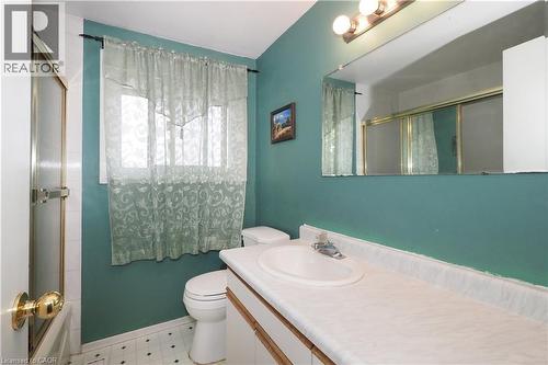 Bathroom featuring vanity, enclosed tub / shower combo, and light flooring - 10 Balfour Crescent, Kitchener, ON - Indoor Photo Showing Bathroom
