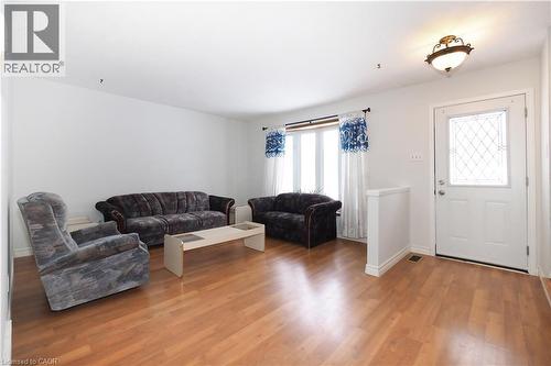 Living room featuring light wood-style flooring and baseboards - 10 Balfour Crescent, Kitchener, ON - Indoor