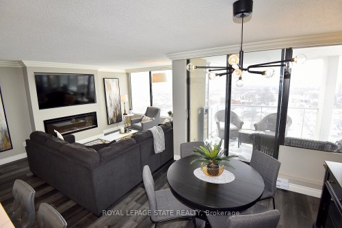 1707-75 Queen Street N, Hamilton, ON - Indoor Photo Showing Dining Room With Fireplace