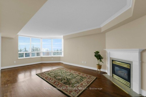 707-89 Skymark Drive, Toronto, ON - Indoor Photo Showing Living Room With Fireplace