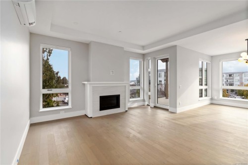 306-990 Doumac Ave, Saanich, BC - Indoor Photo Showing Living Room With Fireplace