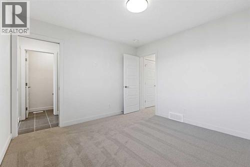 220 Waterford Heath, Chestermere, AB - Indoor Photo Showing Other Room