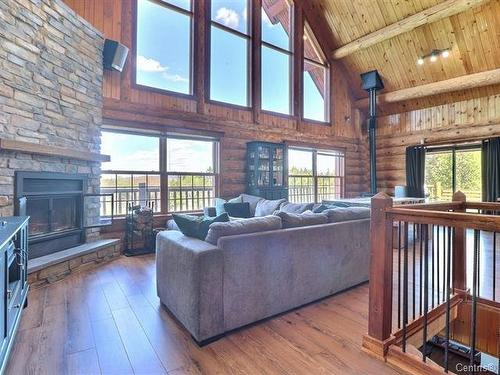 Living room - 182 2E Rang, Saint-Herménégilde, QC - Indoor Photo Showing Living Room With Fireplace