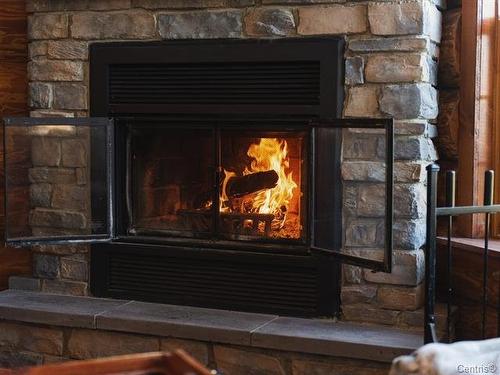 Living room - 182 2E Rang, Saint-Herménégilde, QC - Indoor With Fireplace