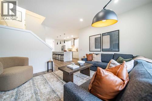 1149 Sailfin Heath, Rural Rocky View County, AB - Indoor Photo Showing Living Room With Fireplace