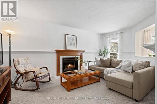 27 Avonmore Crescent, Ottawa, ON - Indoor Photo Showing Living Room With Fireplace