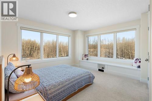 Primary Bedroom- Upper Level - 22 Bearspaw Summit Place, Rural Rocky View County, AB - Indoor Photo Showing Bedroom
