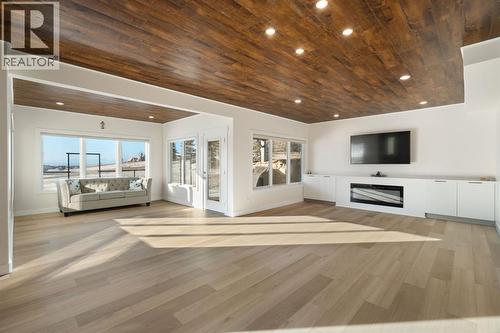 Family Room- Basement - 22 Bearspaw Summit Place, Rural Rocky View County, AB - Indoor Photo Showing Other Room