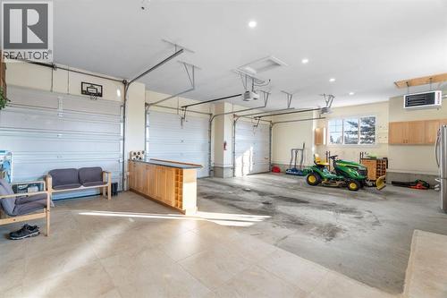 3 car Attached garage - 22 Bearspaw Summit Place, Rural Rocky View County, AB - Indoor Photo Showing Garage