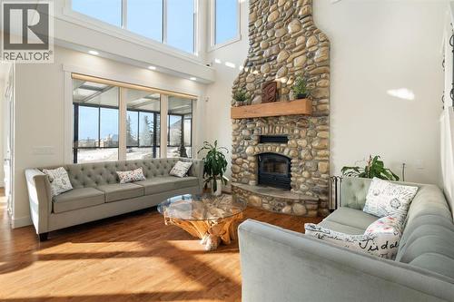 Family Room - 22 Bearspaw Summit Place, Rural Rocky View County, AB - Indoor Photo Showing Living Room With Fireplace