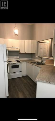 10231 107 Avenue, Grande Prairie, AB - Indoor Photo Showing Kitchen With Double Sink