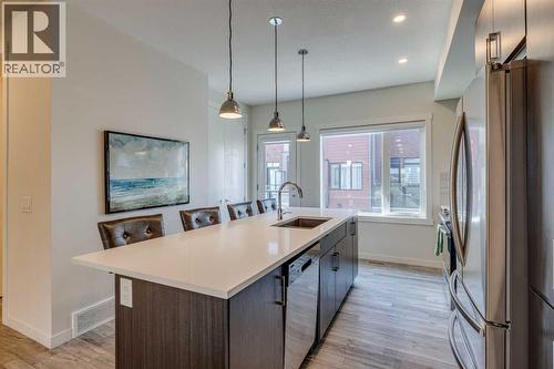 Patio on the south side also, just off the kitchen - 614 Greenbriar Common Nw, Calgary, AB - Indoor Photo Showing Kitchen With Upgraded Kitchen
