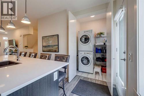 Laundry room off the kitchen - 614 Greenbriar Common Nw, Calgary, AB - Indoor Photo Showing Laundry Room
