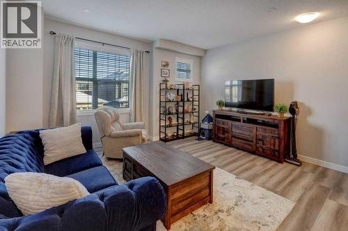 703, 115 Sagewood Drive Sw, Airdrie, AB - Indoor Photo Showing Living Room