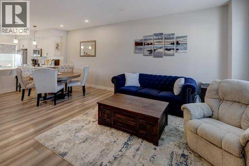 703, 115 Sagewood Drive Sw, Airdrie, AB - Indoor Photo Showing Living Room