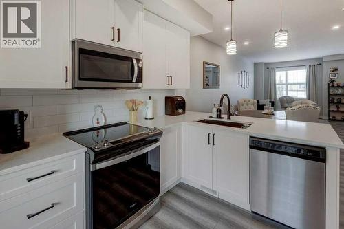 703, 115 Sagewood Drive Sw, Airdrie, AB - Indoor Photo Showing Kitchen