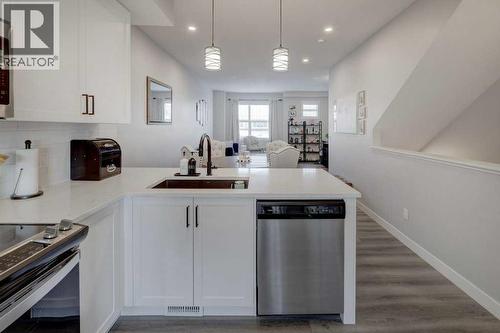 703, 115 Sagewood Drive Sw, Airdrie, AB - Indoor Photo Showing Kitchen
