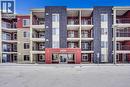 BUILDING MAIN ENTRANCE - 411, 15 Saddlestone Way Ne, Calgary, AB  - Outdoor With Balcony With Facade 