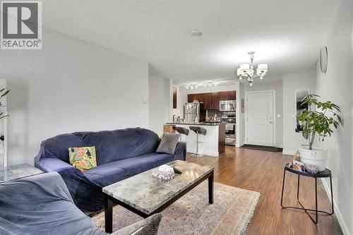 411, 15 Saddlestone Way Ne, Calgary, AB - Indoor Photo Showing Living Room