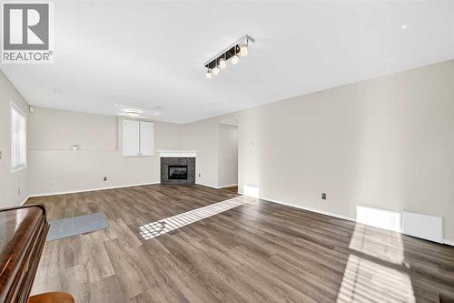 30 Tuscarora Way Nw, Calgary, AB - Indoor With Fireplace