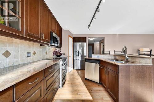 30 Tuscarora Way Nw, Calgary, AB - Indoor Photo Showing Kitchen With Stainless Steel Kitchen With Double Sink
