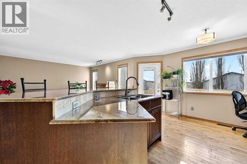 30 Tuscarora Way Nw, Calgary, AB - Indoor Photo Showing Kitchen With Double Sink