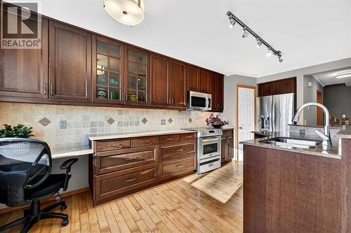 30 Tuscarora Way Nw, Calgary, AB - Indoor Photo Showing Kitchen With Double Sink