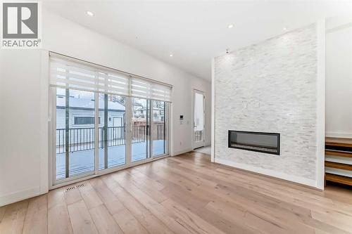 923 36A Street Nw, Calgary, AB - Indoor With Fireplace