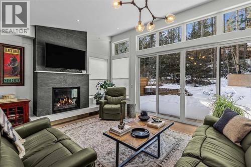 283C Three Sisters Drive, Canmore, AB - Indoor Photo Showing Living Room With Fireplace