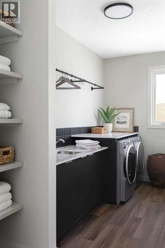 147 Siltstone Place, Balzac, AB - Indoor Photo Showing Laundry Room