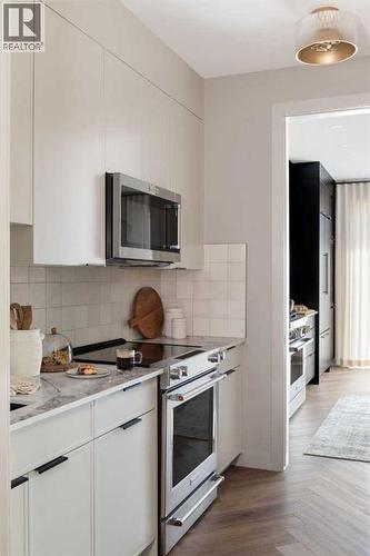 147 Siltstone Place, Balzac, AB - Indoor Photo Showing Kitchen