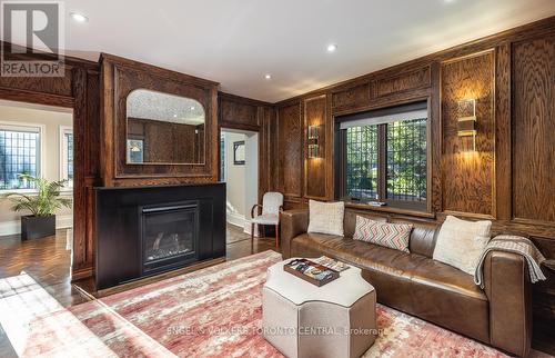 Custom wood panelling w/ fireplace - 1 Bryce Avenue, Toronto, ON - Indoor Photo Showing Living Room With Fireplace