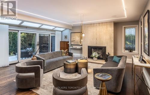 Sun-filled living room with gas fireplace - 1 Bryce Avenue, Toronto, ON - Indoor Photo Showing Living Room With Fireplace