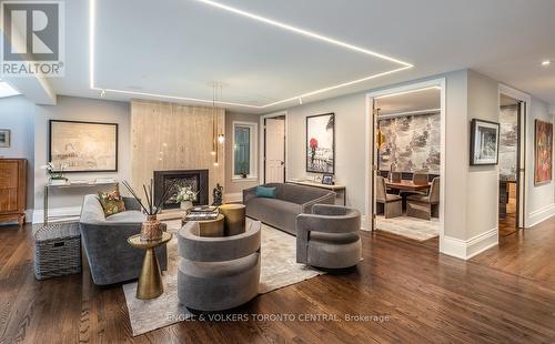 Inlay strip lighting and designer fixtures - 1 Bryce Avenue, Toronto, ON - Indoor Photo Showing Living Room With Fireplace