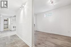 Hall featuring healthy amount of natural light and rail lighting - 